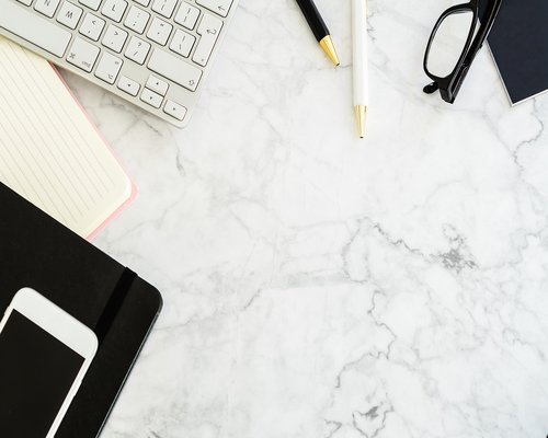Close-up of a well-organized, ergonomically optimized desk setup with a good chair